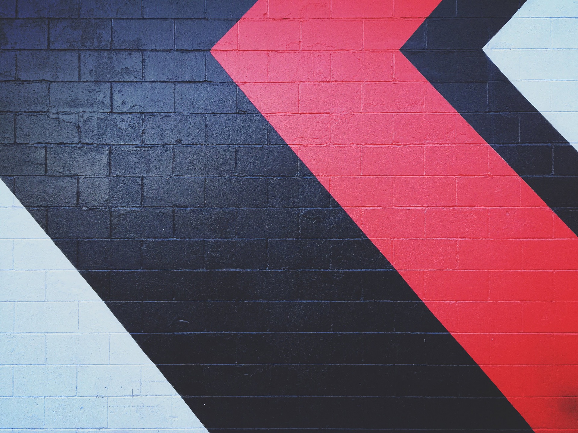 painted arrows on brick